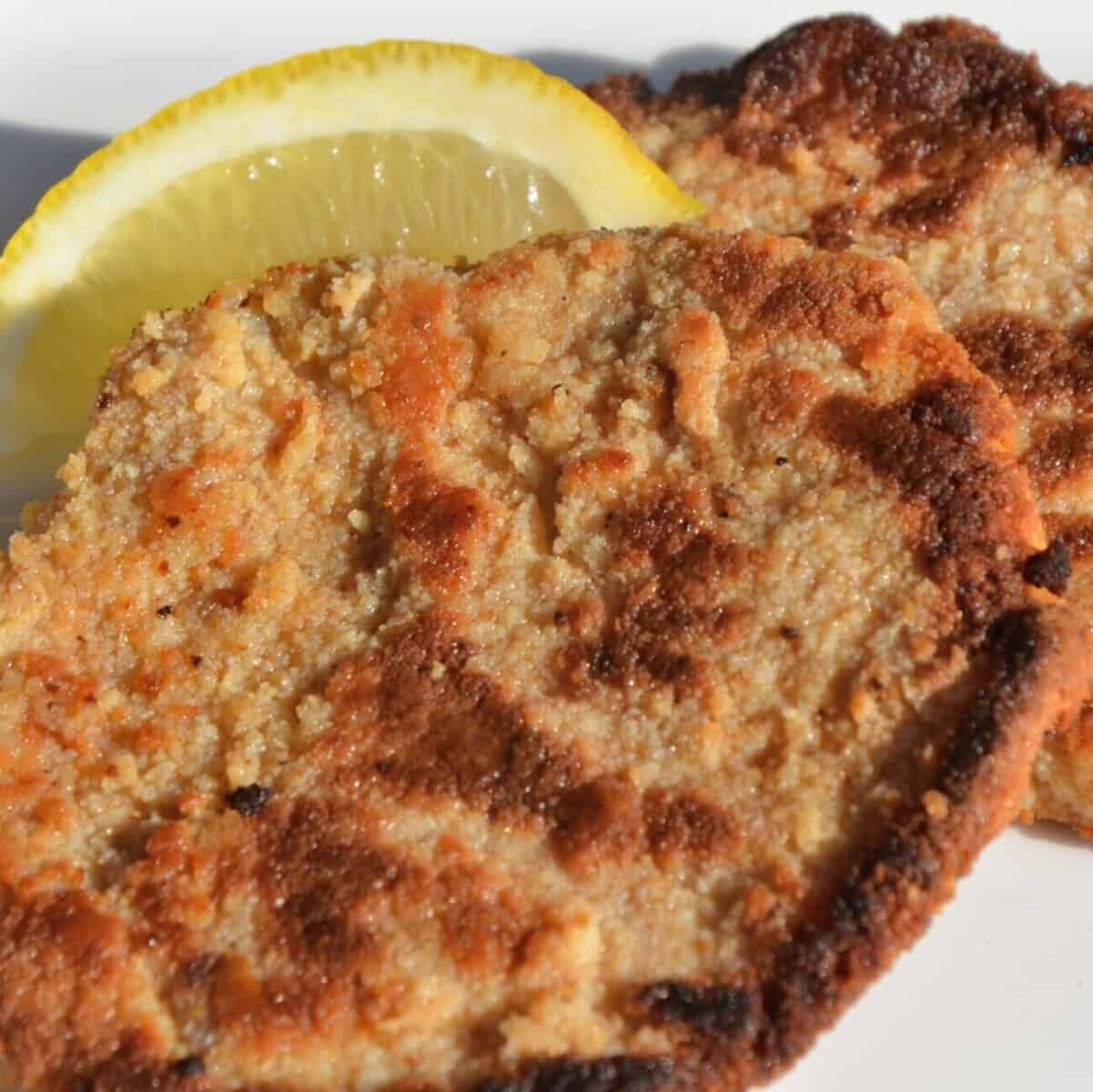 Schnitzel with lemon wedge.