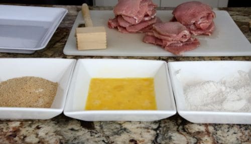 Cutlets with four, egg and bread crumb dredging bowls