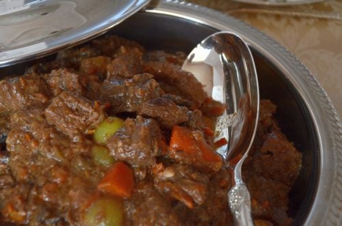 Brandied beef bourguignon in a serving dish.