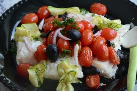 Roasted Cod with grape tomatoes and zucchini slices.