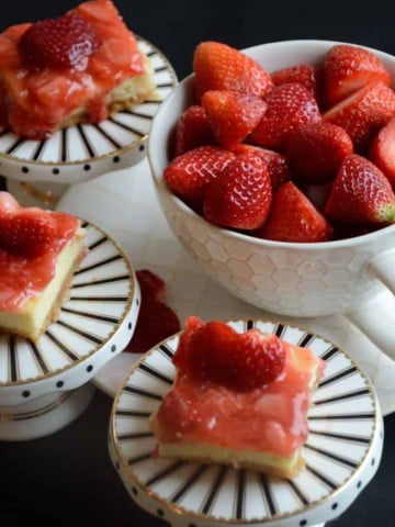 Fresh strawberries on creamy ricotta cheesecake squares.