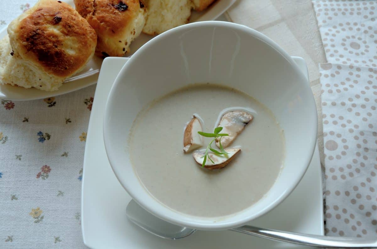 Creamy mushroom soup in a white bowl.