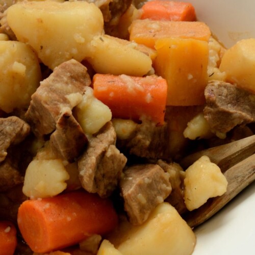 Close up of stewed beef, carrots and potatoes.