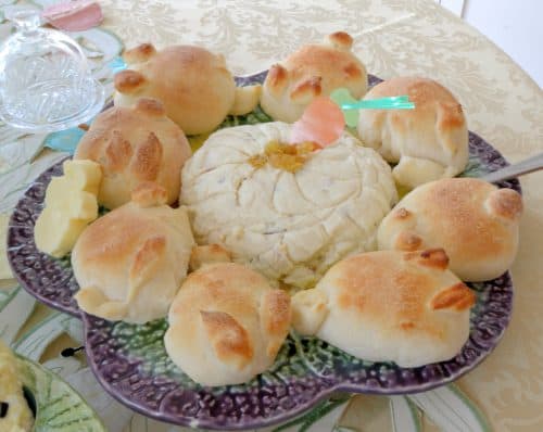 Pashka Easter cheese with buns on a platter.