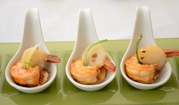Shrimp in a ceramic spoon.