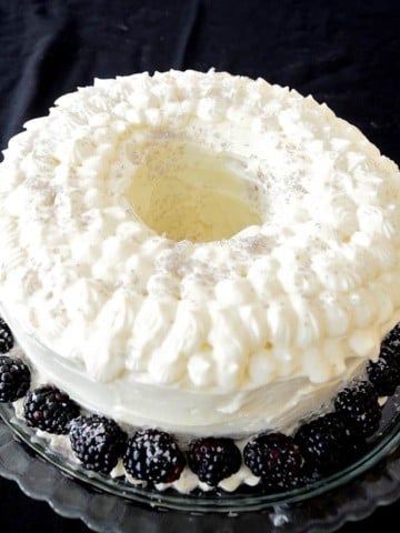 Liqueur Bundt Cake with Cream Cheese Icing on a platter.