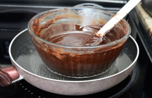 Chocolate melting in a bowl in a skillet