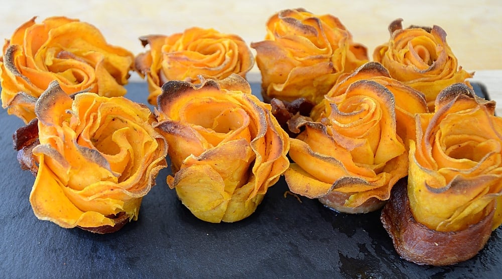 Roses made from sweet potato slices, wrapped in bacon slices.