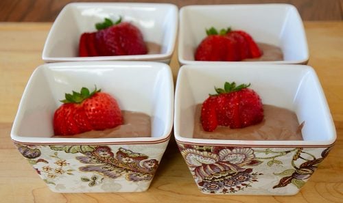 Chocolate non-dairy ice cream garnished with fresh strawberries