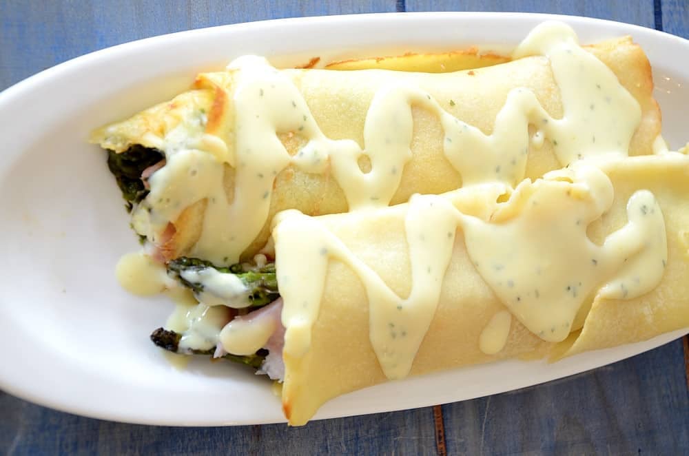 Ham and Asparagus Crepes on a plate.