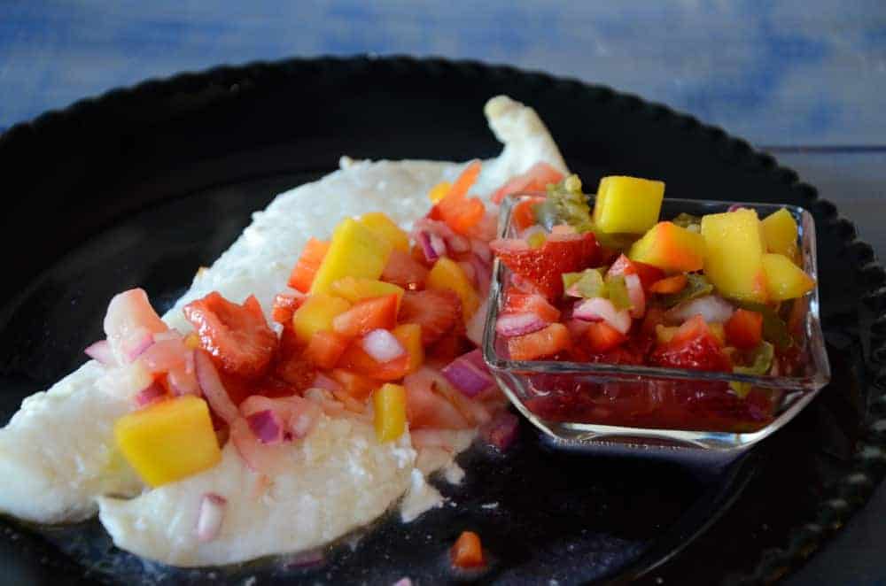 Orange Roughy with Mango Salsa on a plate.