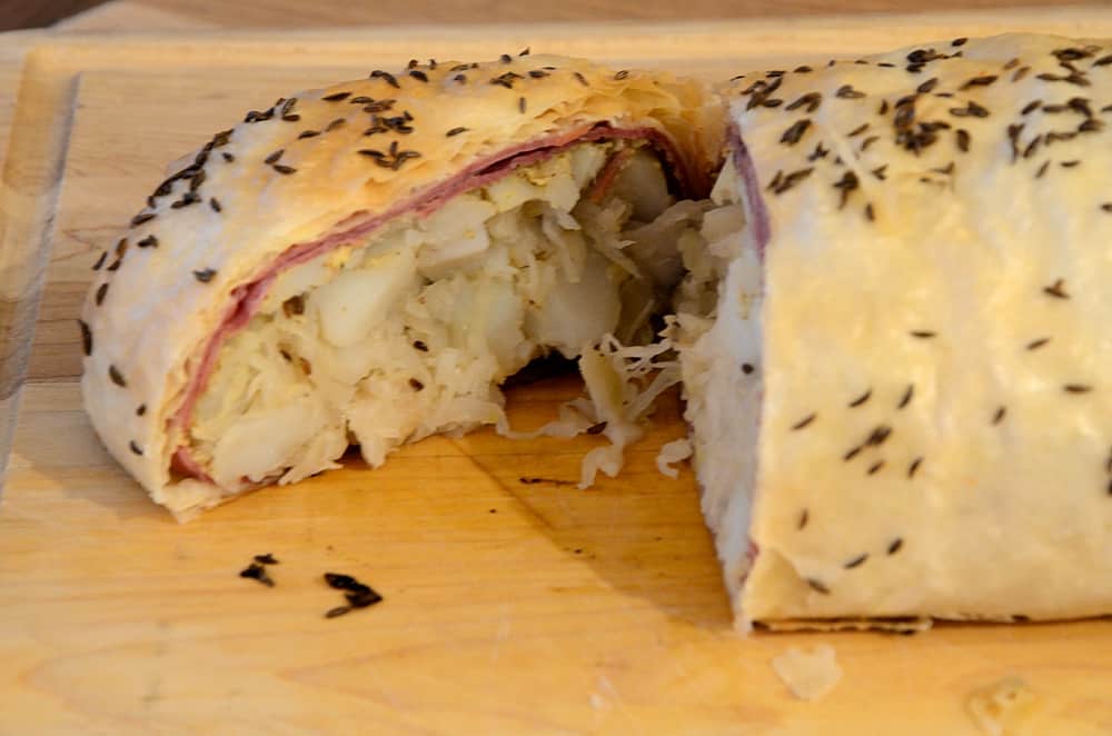 Reuben strudel loaf cut open.