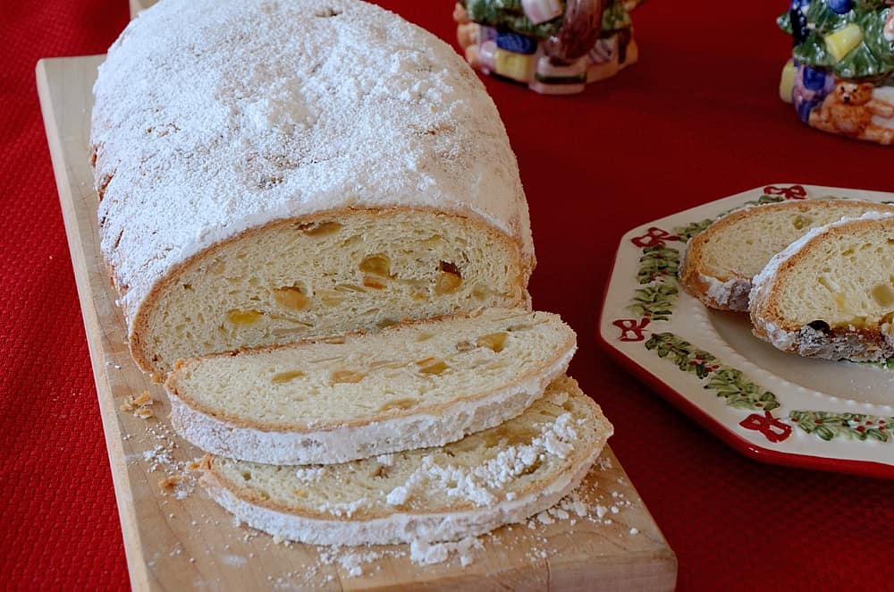 Sliced Christmas Stollen Loaf on a bread board.