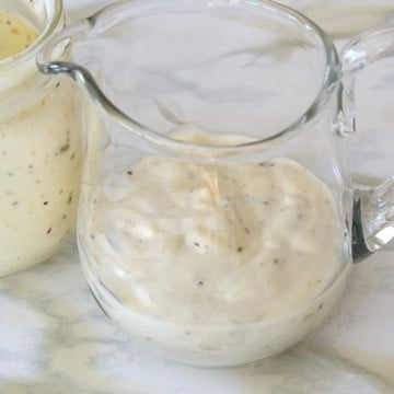 Creamy Lemon Pepper Salad Dressing in a serving cup