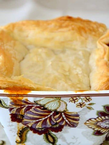 Square soup bowl, broken through puff pastry to lobster bisque