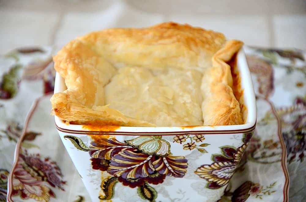 Square soup bowl, broken through puff pastry to lobster bisque