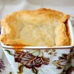 Square soup bowl of lobster bisque with puff pastry topping