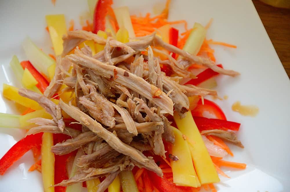 Shredded duck meat on a bed of julienned mango, carrot and celery.