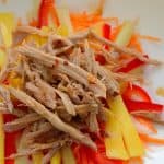 Shredded duck meat on bed of julienned mango, carrot and celery