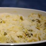 Cooked rice with artichokes and capers in a casserole.