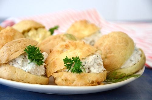 Gourgères filled with chicken salad and egg salad on a plate