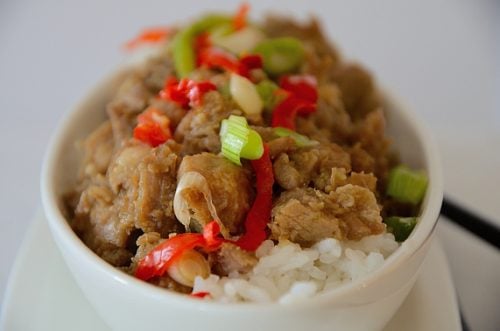 Cubed pork with caramelized sauce, red peppers and green onions.