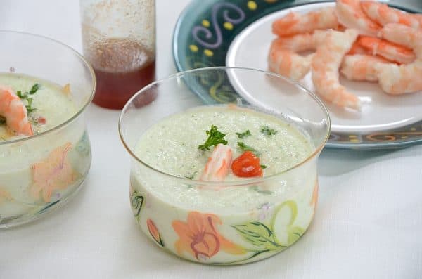 Cold cucumber soup with shrimp and paprika syrup garnish