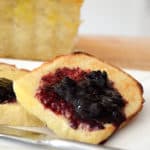 Two toasted slices of bagel bread with jam