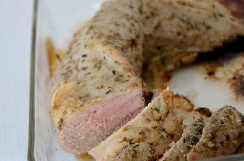 Pork tenderloin roasted in Greek dressing and sliced