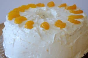 Mandarin Chiffon Layer cake with Yogurt Cream Cheese Frosting and decorated with mandarin pieces