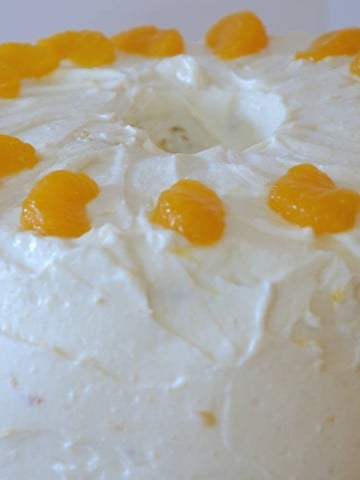 Mandarin Chiffon Layer cake with Yogurt Cream Cheese Frosting and decorated with mandarin pieces