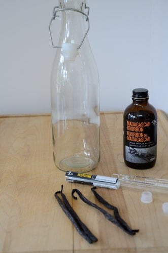 vanilla extract bottle, empty bottle and 4 vanilla beans