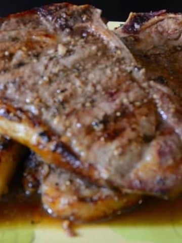 Close up of grilled strip loin steack with juicy marinade caramelized on it