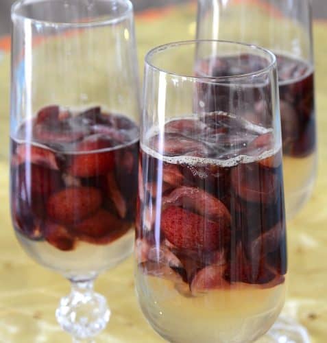 Champagne gelatin with fresh cherries in a champagne flute