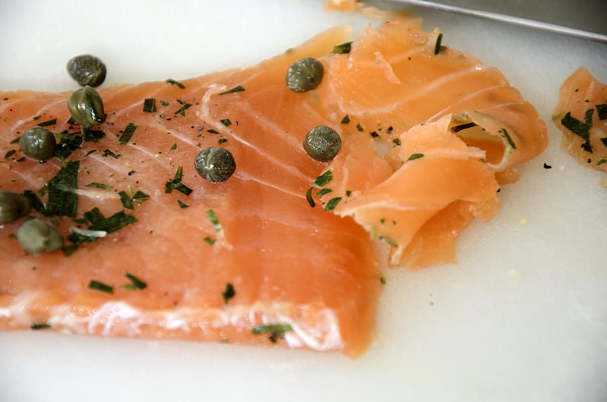 A fillet of cured salmon with capers and tarragon.