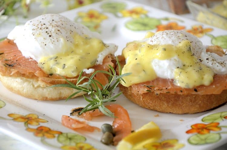 two poached eggs on croissant buns with cured salmon and bearnaise sauce.