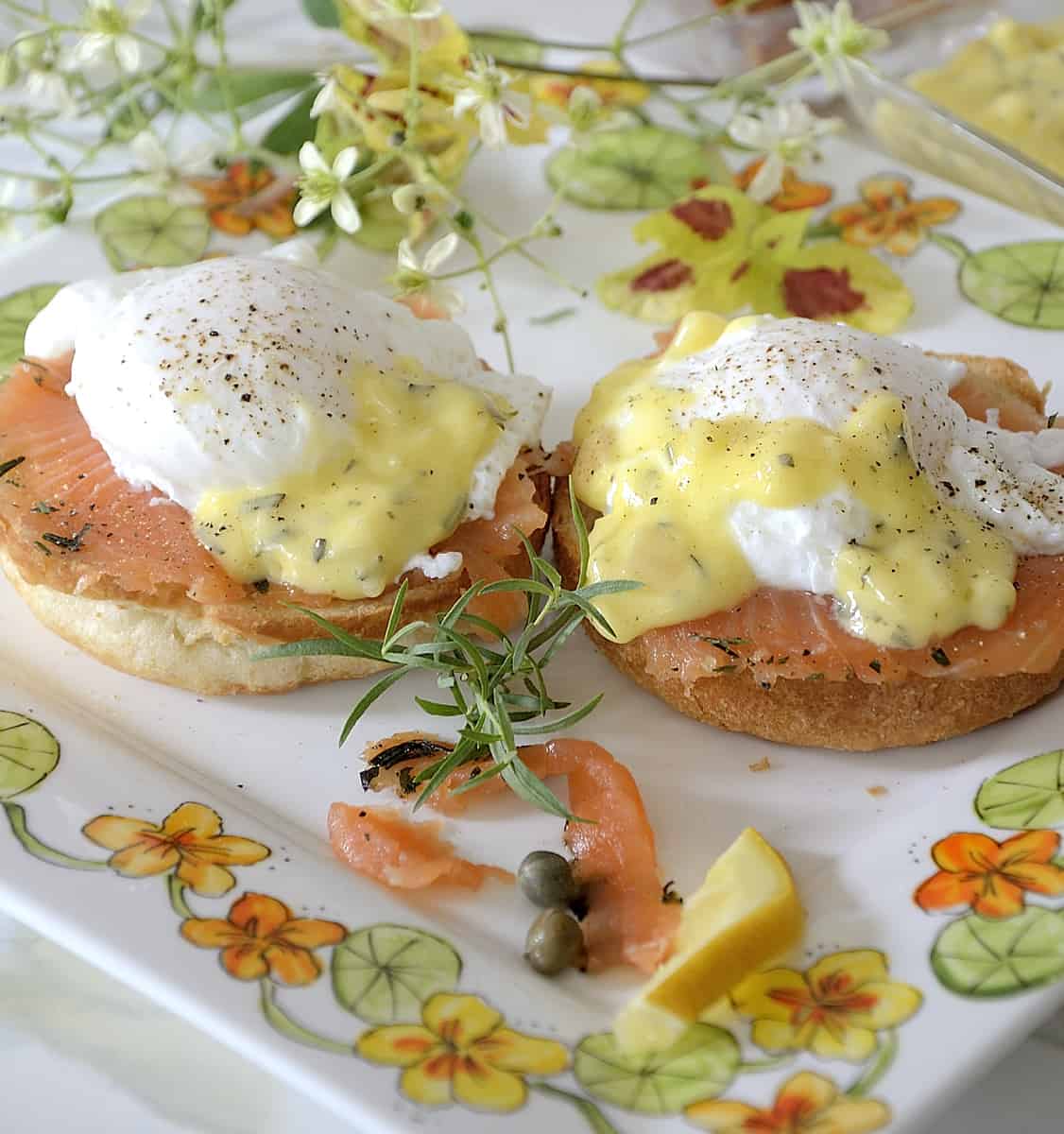 two poached eggs on croissant buns with cured salmon and bearnaise sauce.