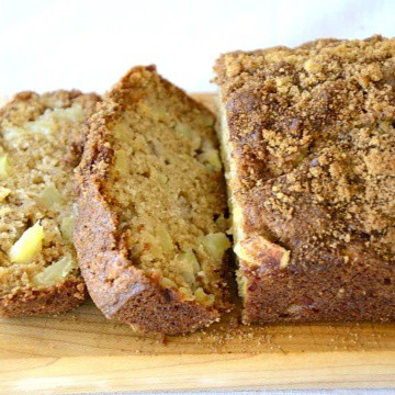 Loaf of Cinnamon Apple quick bread with brown sugar and cinnamon topping.