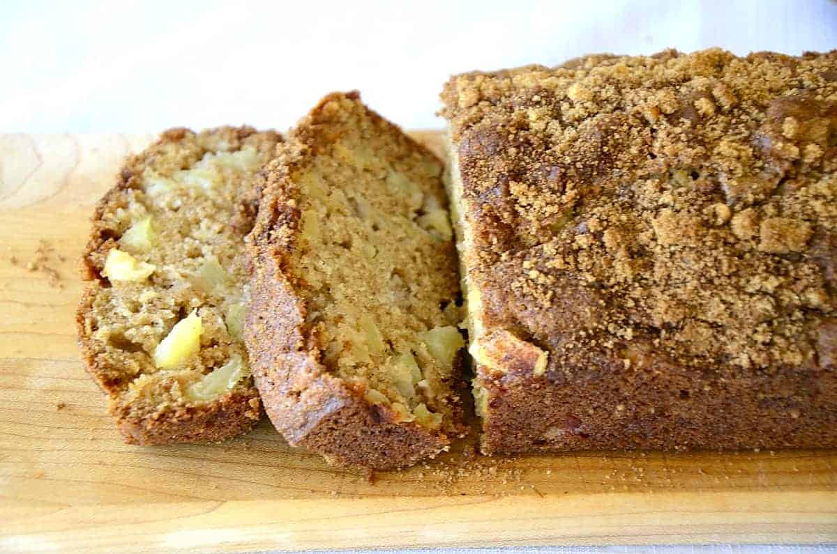 Loaf of Cinnamon Apple quick bread with brown sugar and cinnamon topping.