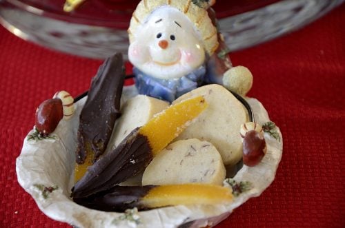 Pecan shortbread and chocolate dipped candied orange peel on a Christmas cookie plate.