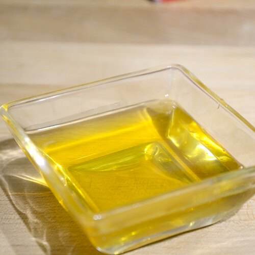 Golden, clear ghee in a small saucer.