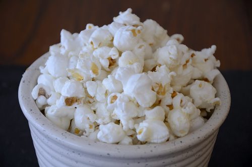 Bowl of fluffy sweet and salty popcorn.