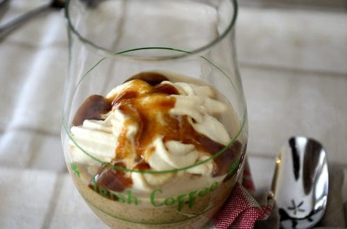 Irish coffee glass filled with mocha, caramel mousse topped with Bailey's whipped cream and caramel sauce.