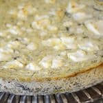 Savoury ricotta cheesecake on a serving platter.