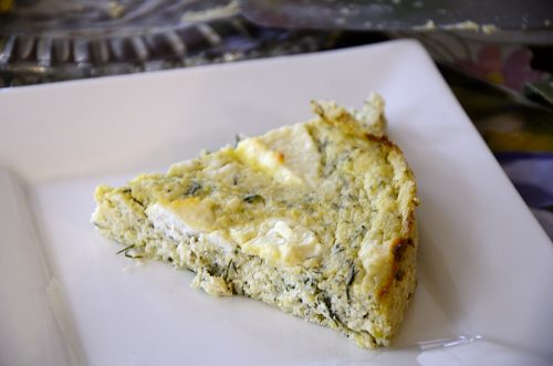 Slice of savoury Ricotta cheesecake on a serving plate.