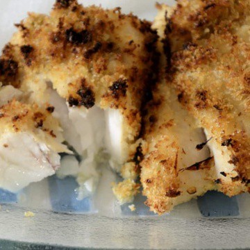 Crispy breaded cod on a platter.