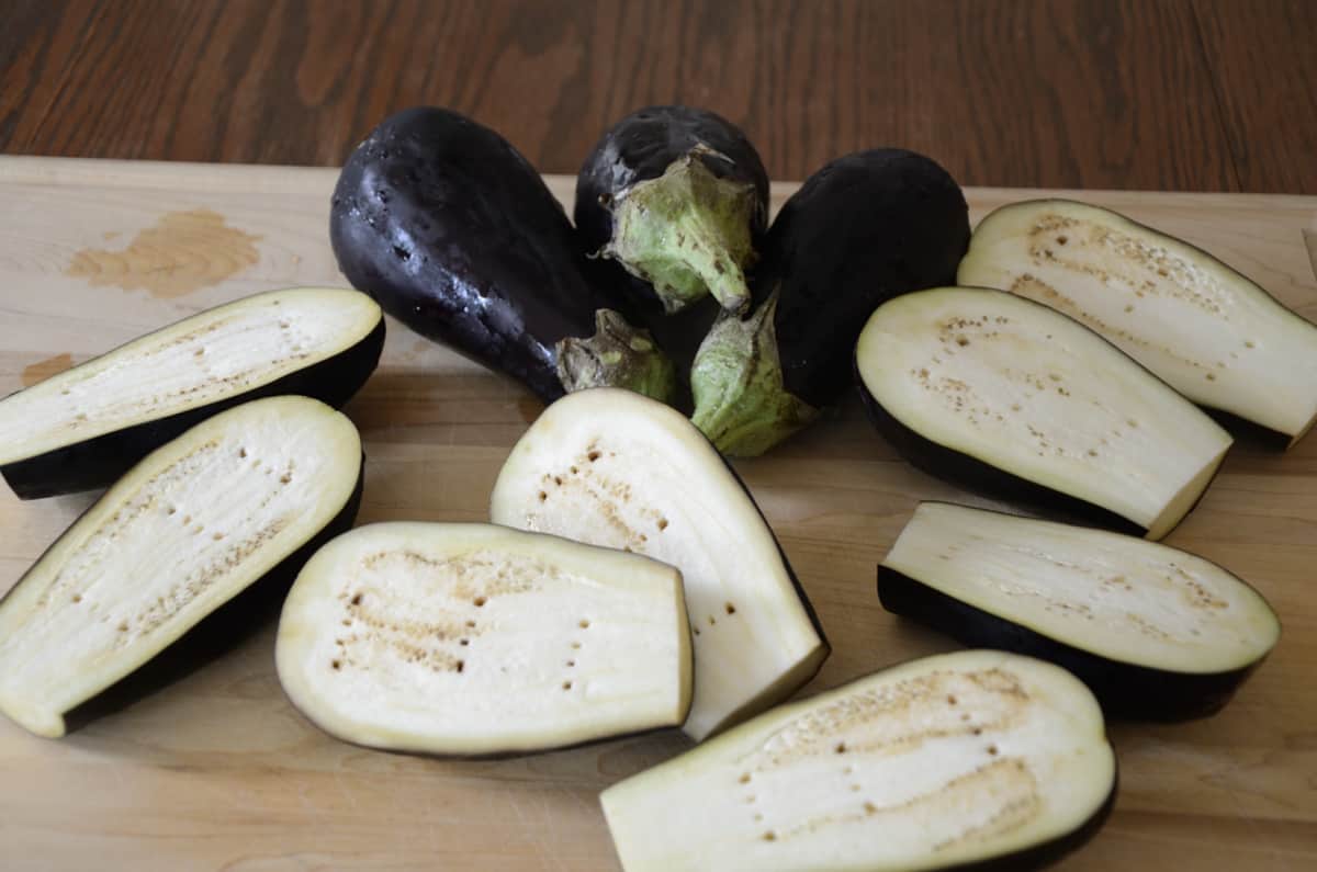 Globe eggplants cut and ready to roast.