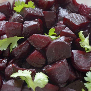Close up of Roasted Balsamic Beets with cilantro garnish.