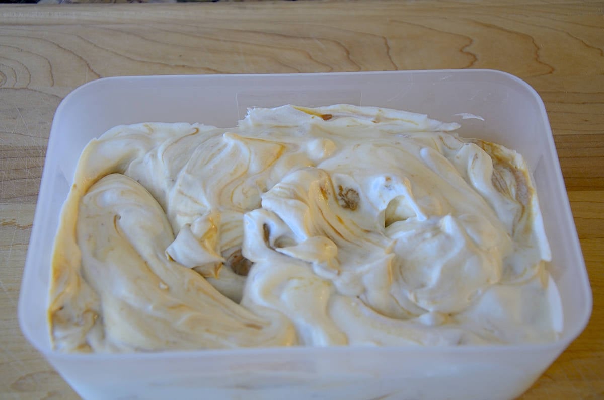 Container of ice cream flavoured with swirls of Dulce de Leche.