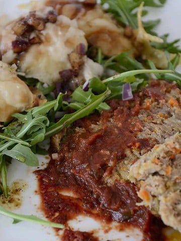 Slices of meatloaf with red wine pasta. sauce.